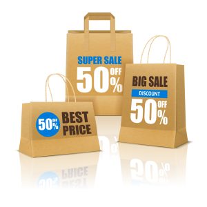 Shopping poster with three paper bags on smooth reflective surface and big sale advertising realistic vector illustration
